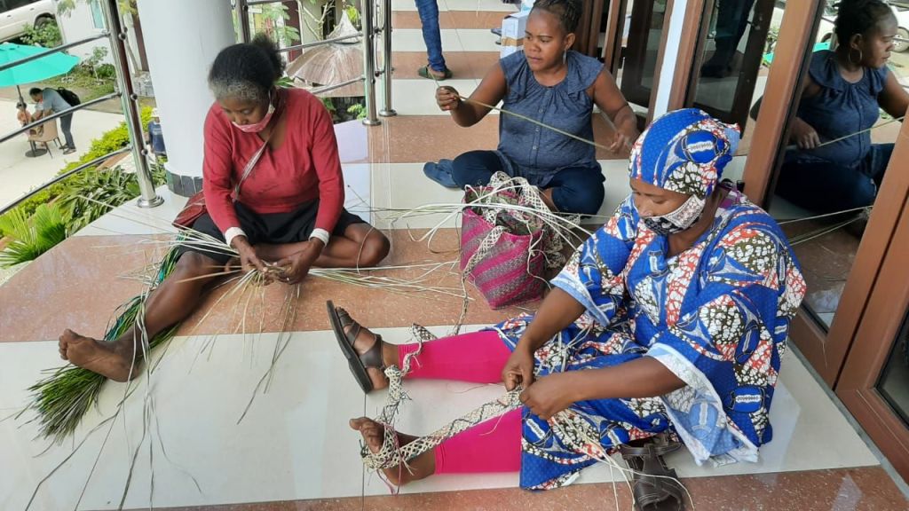 Women weaving basket in Foulepointe Madagascar.